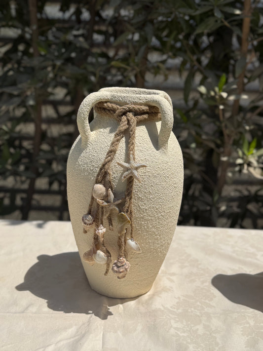Pottery vase with shells